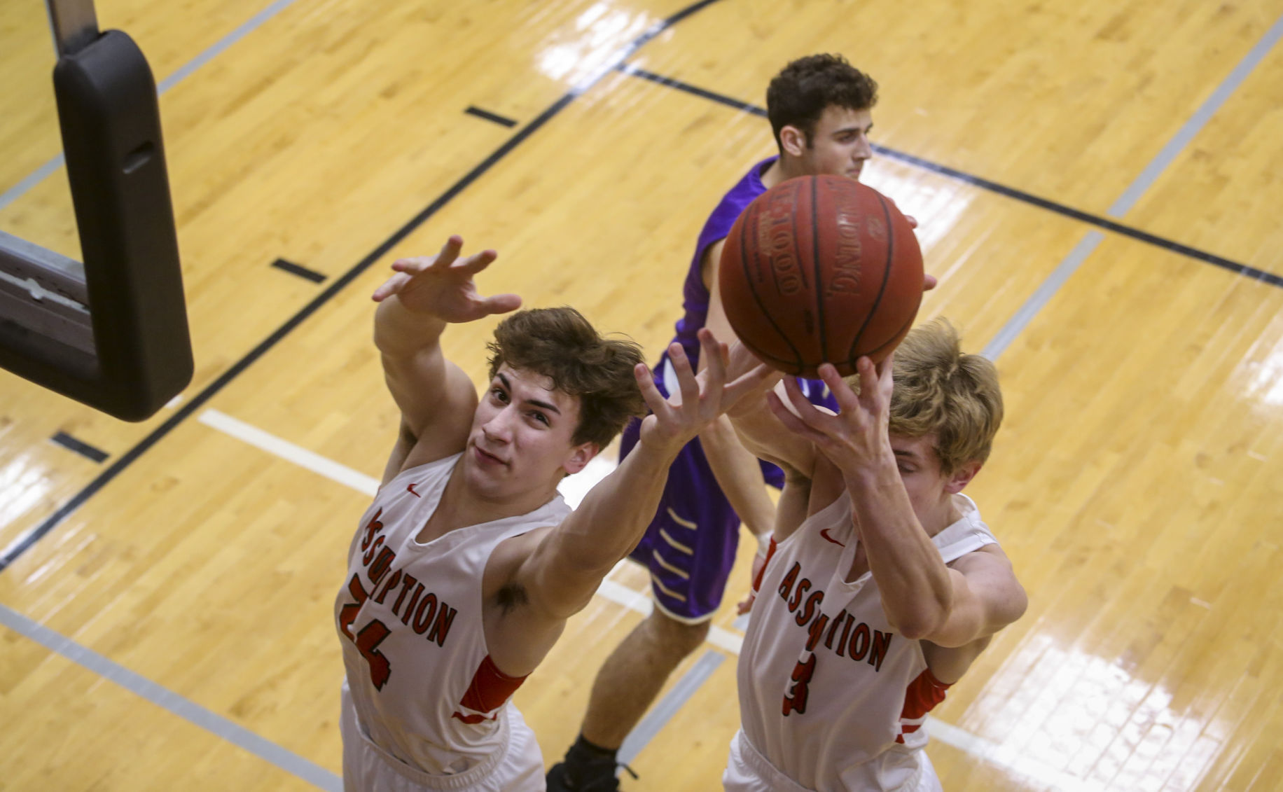010918-MUSCATINE-ASSUMPTION-BASKETBALL-010